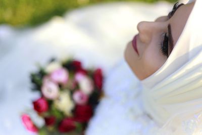 High angle view of thoughtful bride wearing hijab outdoors