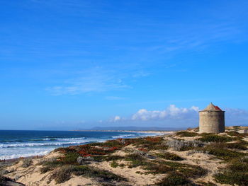 Scenic view of sea against blue sky