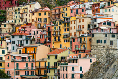 Scenic view of colorful houses in cinque terre village riomaggiore, manarola, italy