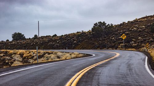 Empty road against sky