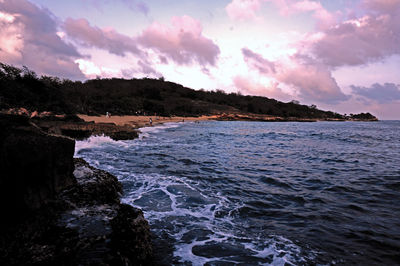 Scenic view of sea against cloudy sky