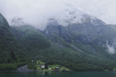 Scenic view of lake and mountains against sky
