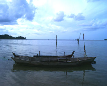 Scenic view of sea against cloudy sky