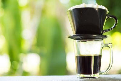 Close-up of coffee cup on table