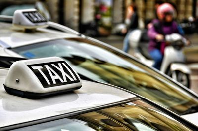 Close-up of taxis on char