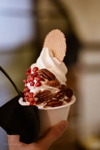 Close-up of hand holding ice cream