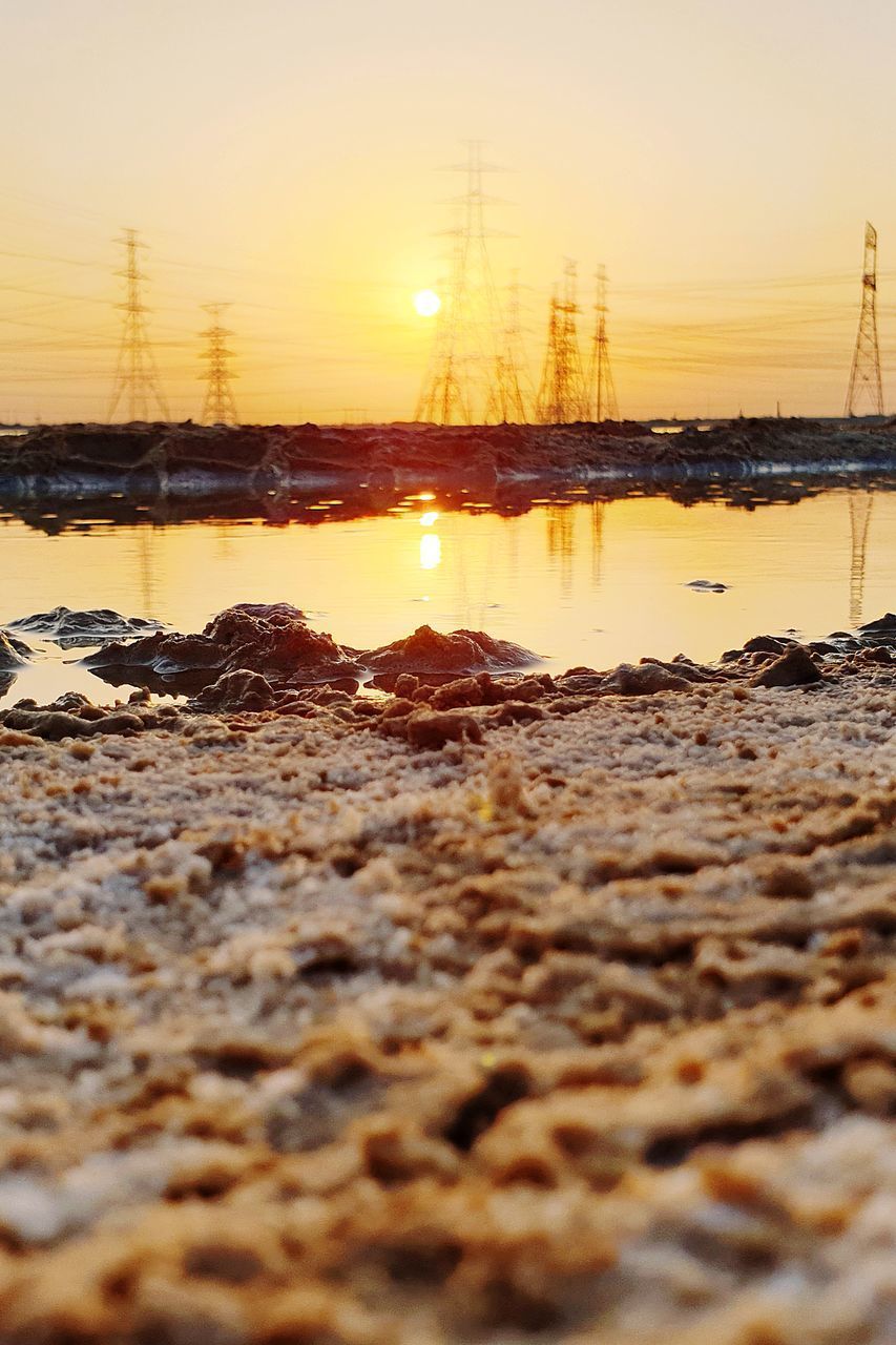 SURFACE LEVEL OF SEA AGAINST SKY DURING SUNSET