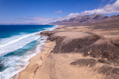 Scenic view of beach against sky