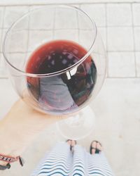 Cropped image of woman holding wineglass