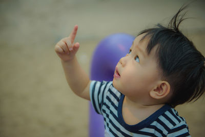 Portrait of cute boy looking away