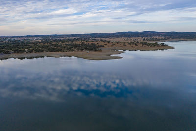 Drone aerial panorama of a dam lake reservoir landscape in terena, portugal