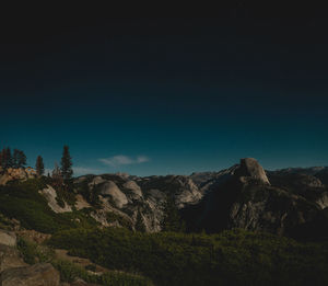 Scenic view of mountains against sky at night