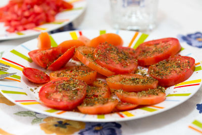 Close-up of tomato salad in plate on table