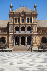 Facade of historic building against clear sky