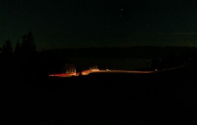 Light trails against sky at night