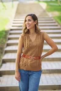 Portrait of young woman standing outdoors