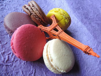 Close-up of colorful macaroons and replica eiffel tower