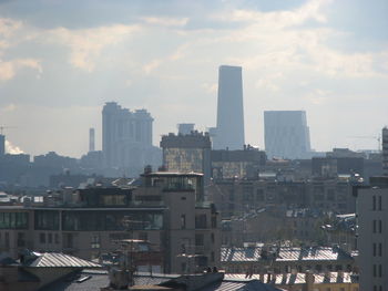 Buildings in city against sky