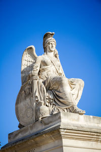 Low angle view of statue against sky