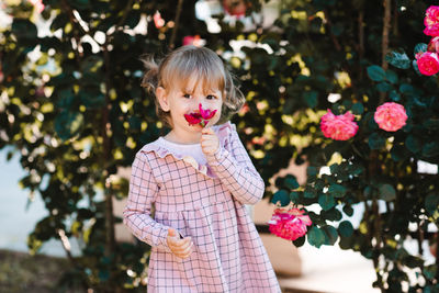 Portrait of cute girl standing outdoors
