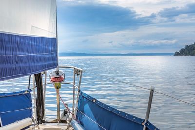 Cropped image of boat on sea against sky