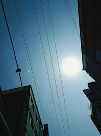 Low angle view of cables against sky