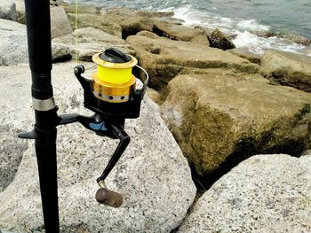High angle view of rocks on sea shore