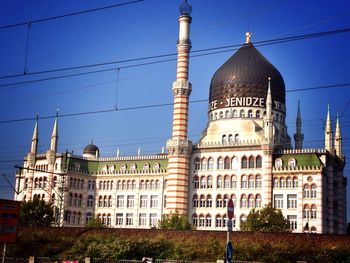 Low angle view of building against blue sky