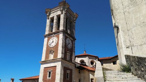 Low angle view of building against clear blue sky