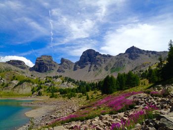 Scenic view of mountains against cloudy sky