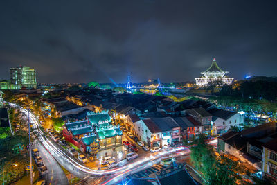 Light trail at kuching city at night raining day