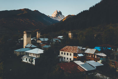 High angle view of buildings and mountains against sky