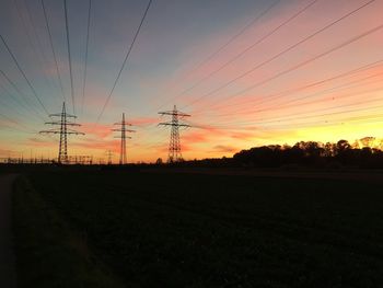 Electricity pylon on field