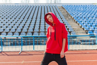 Portrait of woman standing in stadium