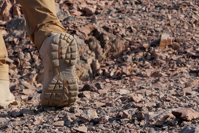 Low section of man walking in the desert 