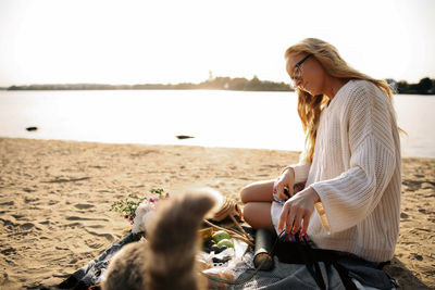 Woman sitting at beach