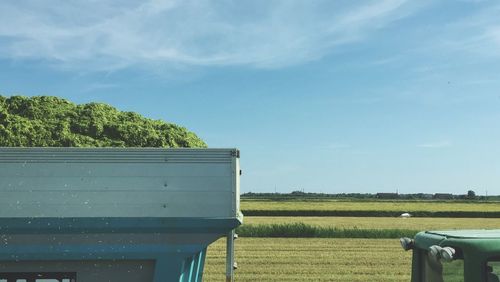 Scenic view of field against blue sky