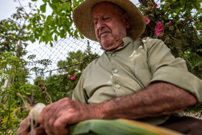 Portrait of man sitting in park