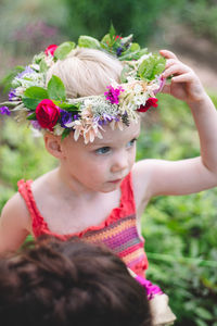 Portrait of cute girl with pink flowers