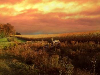 Scenic view of landscape against cloudy sky