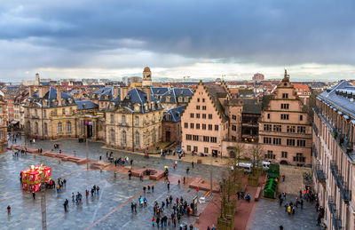 High angle view of people in city against sky