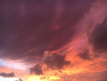 Low angle view of dramatic sky during sunset