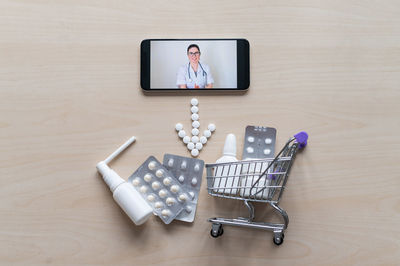 High angle view of smart phone on table