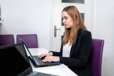 Mid adult woman using mobile phone
