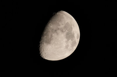 Low angle view of moon against clear sky at night