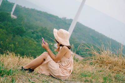 Woman sitting on field