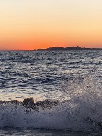 Scenic view of sea against sky during sunset