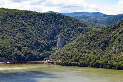 Scenic view of river danube and mountains against sky