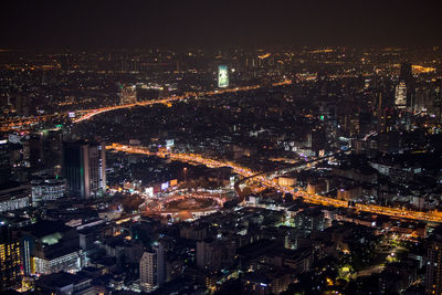 High angle view of illuminated city buildings at night