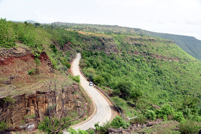 Scenic view of mountain road against sky